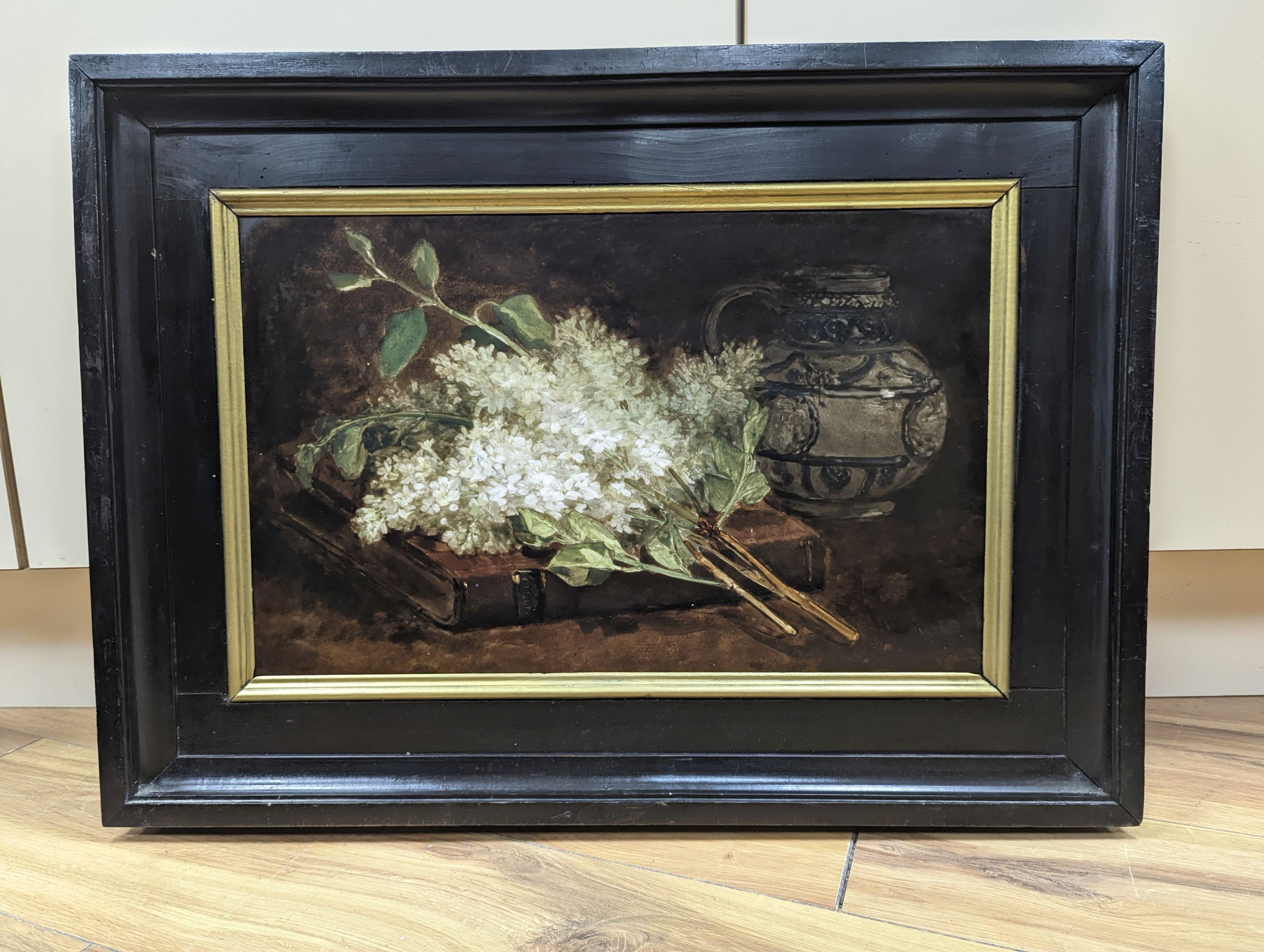 A 19th century porcelain plaque painted with a still life of lilac blossom and a stein, 29 x 46cm